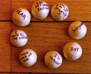 I cut some balls of styrofoam in half, and wrote some thoughts on them that are holding me back.